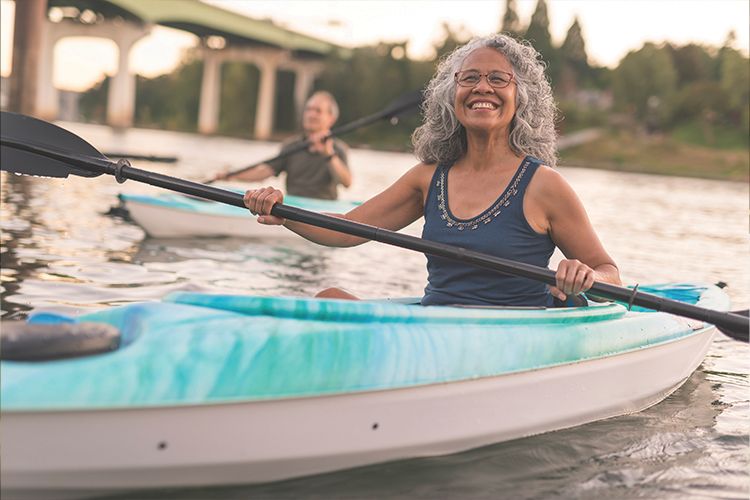 Woman kayaking down the river