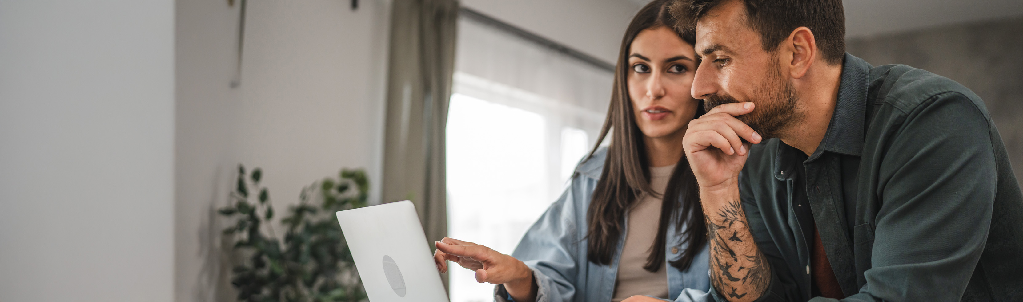 Man and woman looking at computer