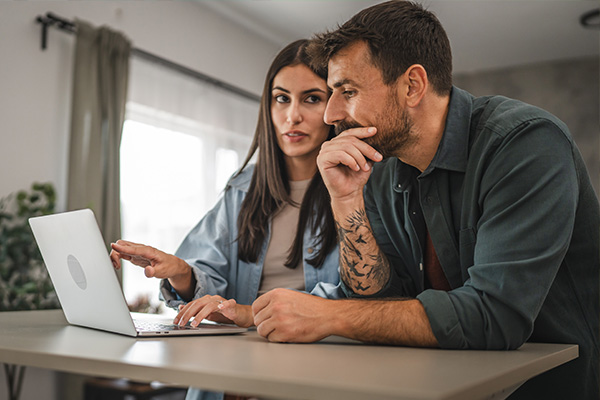Man and woman looking at computer