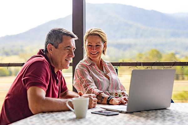 Man and woman looking at a computer