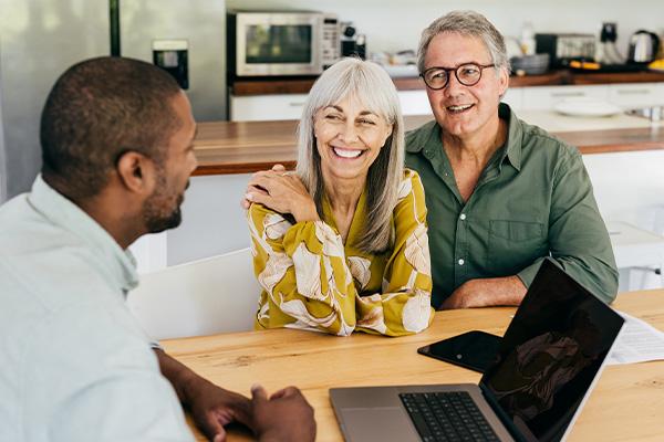A man and woman talking to a man
