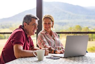 Man and woman looking at a computer