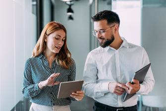 Man and woman looking at a tablet