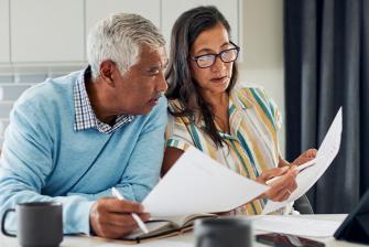 Man and woman looking at paperwork