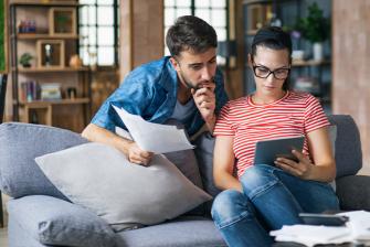 Man and woman looking at a tablet
